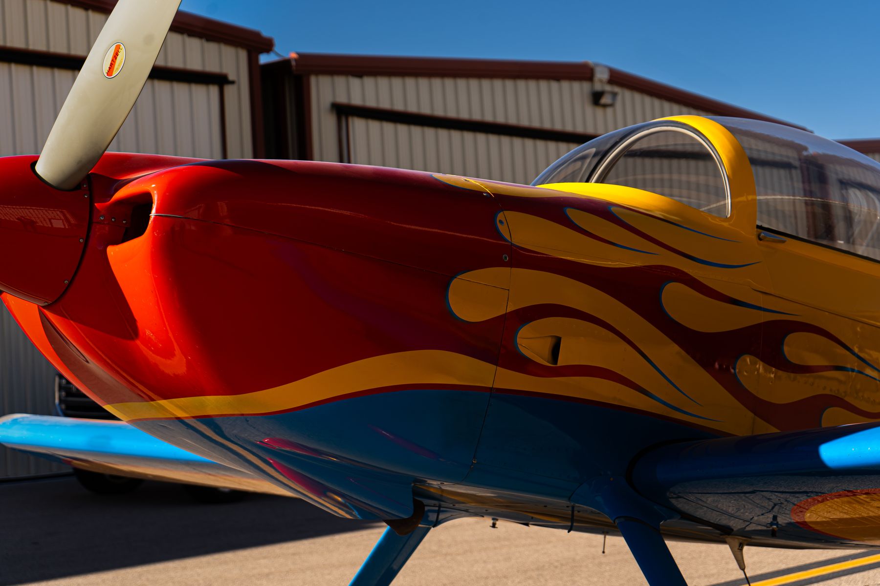 Yellow prop plane with flame paint